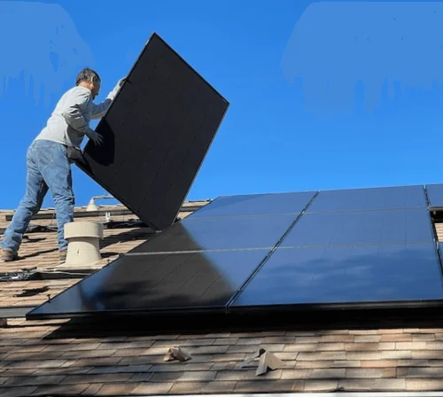 Installing Black Solar Panel On A Rooftop